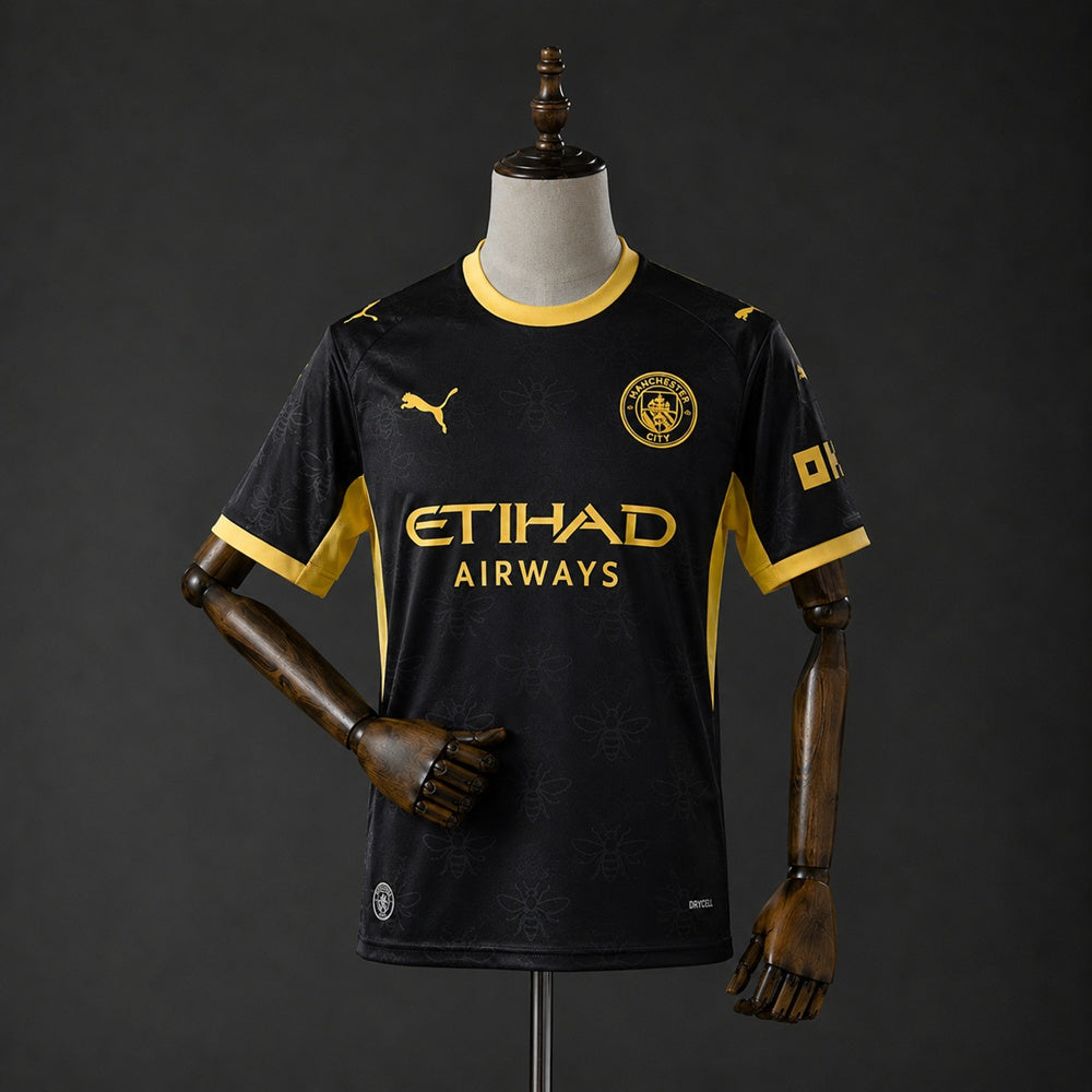 Camisa Manchester City 26/27 - Torcedor Preta e Dourada