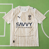 Camisa Al Hillal 25/26 - Torcedor Bege e Dourada Listrada